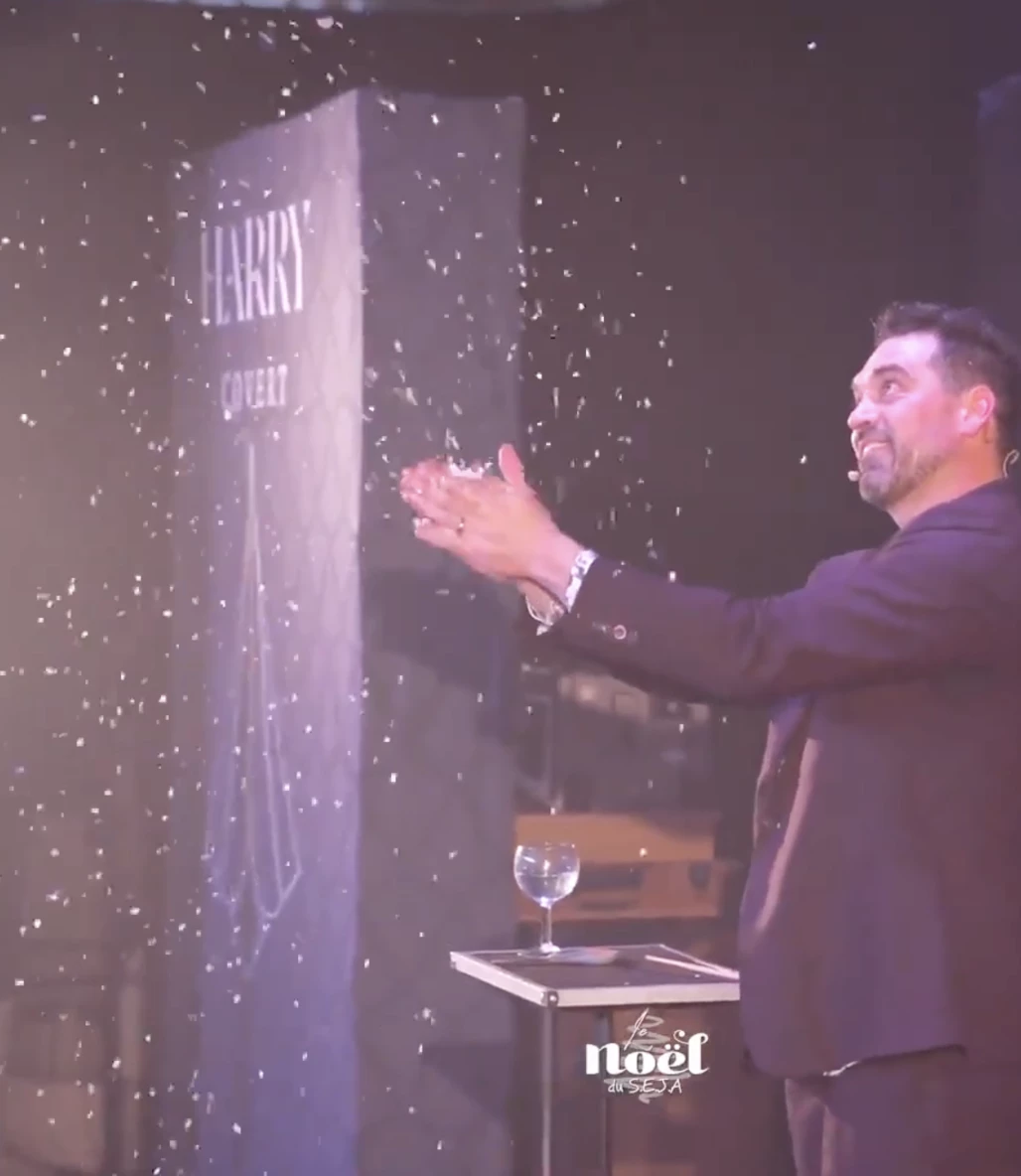 Harry Covert creates a snowstorm during the finale of his magic show